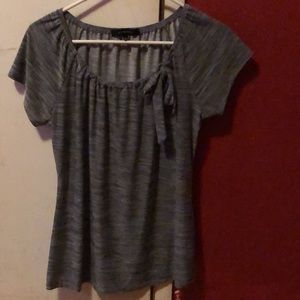 This is a black & white striped top with a side bow.